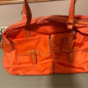 Tumi Duffle style carry on luggage.